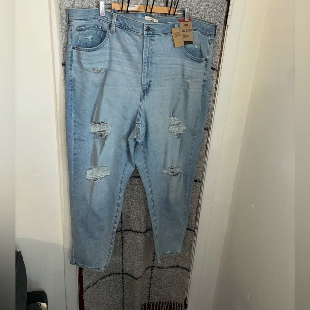 Stone wash plus size high wasted mom jeans.